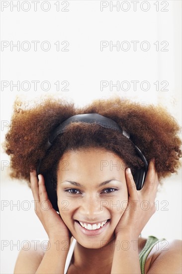 Woman listening to music. Photographer: momentimages