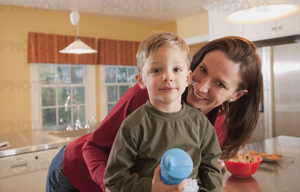 Mother and son in kitchen. Photographer: mark edward atkinson