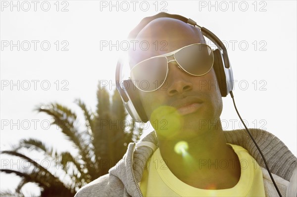 Man wearing headphones. Photographer: momentimages