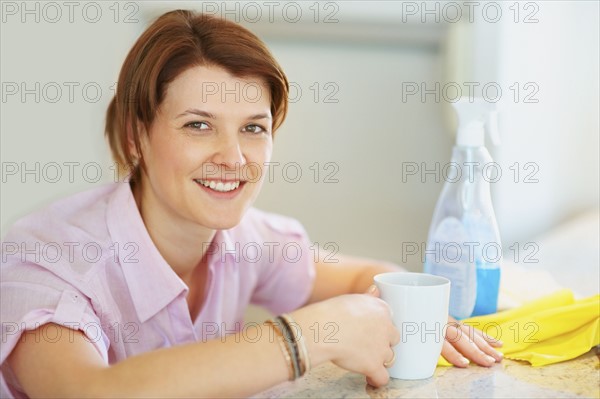 House cleaner taking a break. Photographer: momentimages