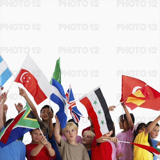 Children waving flags. Photographer: momentimages