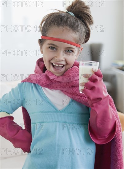 Young girl dressed up as a superhero. Photographer: Jamie Grill