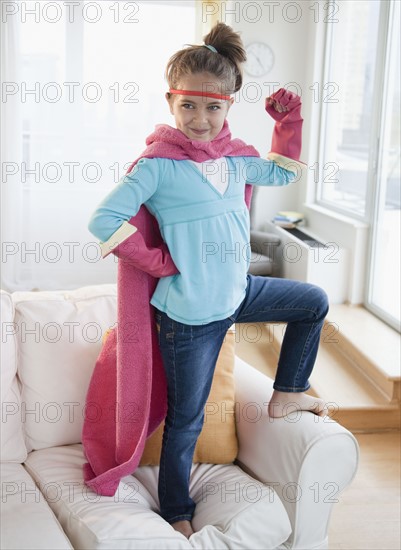 Young girl dressed up as a superhero. Photographer: Jamie Grill