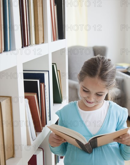 Young girl reading. Photographer: Jamie Grill