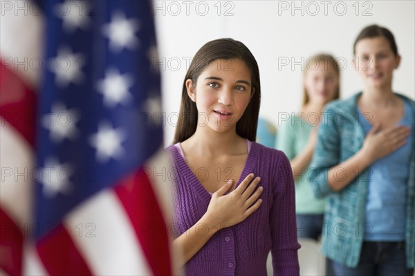 Students saying pledge of allegiance.