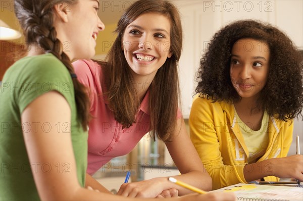 Friends doing homework. Photographer: mark edward atkinson