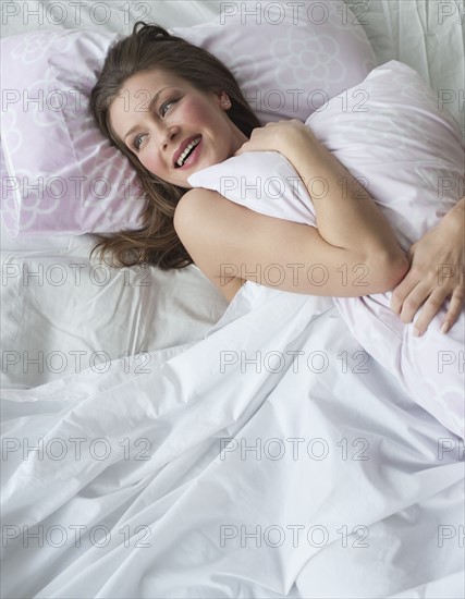 Woman in bed.