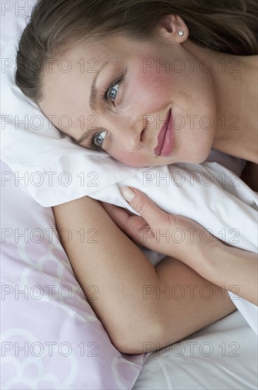 Woman in bed.