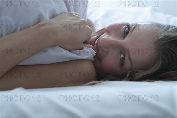 Woman in bed.