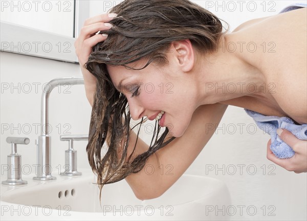 Woman washing hair.