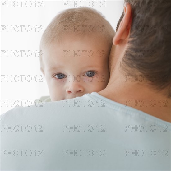 Father holding baby.