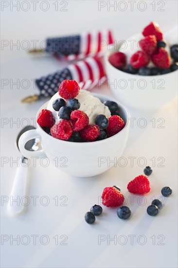 Bowls of ice cream and fruit.