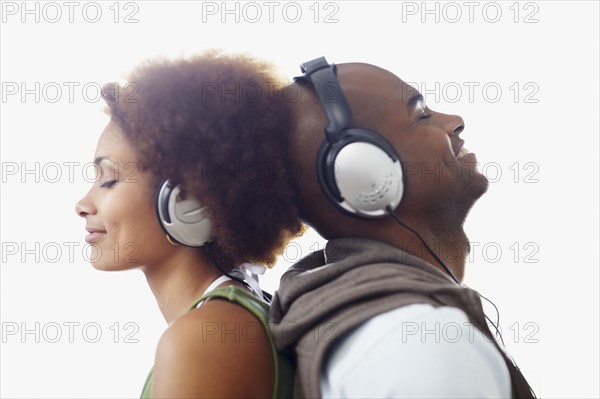 Couple wearing headphones. Photographer: momentimages