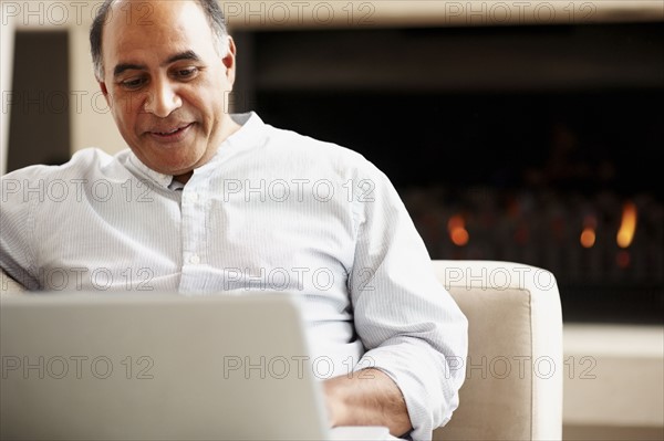 Man working on laptop. Photographer: momentimages