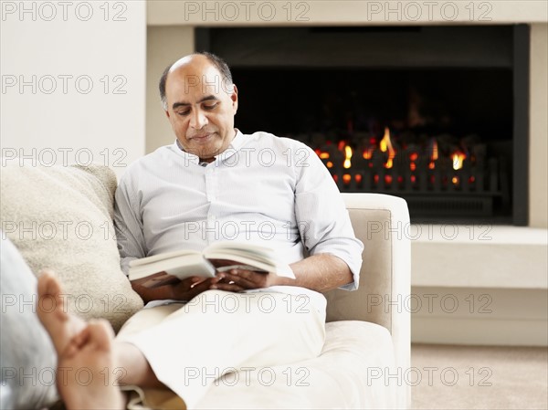 Man reading a book. Photographer: momentimages