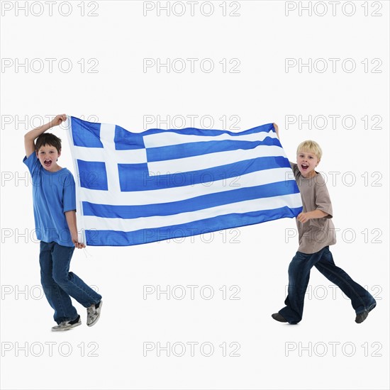 Two boys carrying flag. Photographer: momentimages