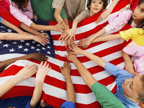 Children holding flag. Photographer: momentimages