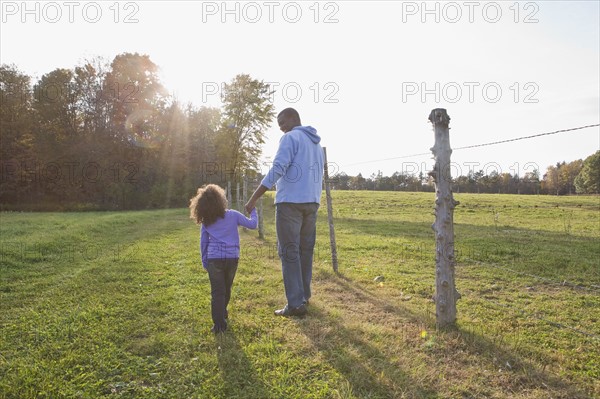 Father and daughter walking. Photographer: Pauline St.Denis
