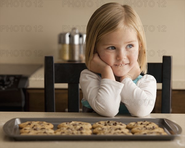 Girl waiting for cookies. Photographer: Mike Kemp