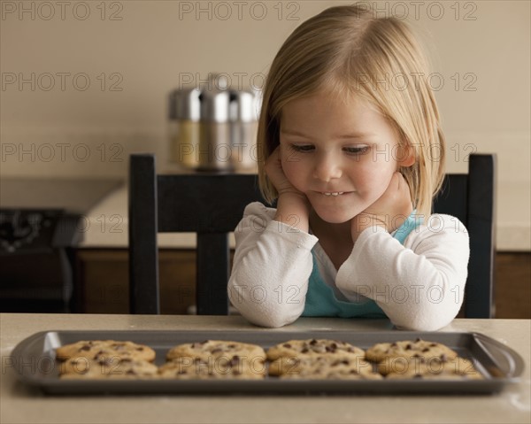 Girl waiting for cookies. Photographer: Mike Kemp