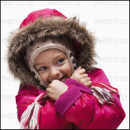 Young girl wearing winter clothing. Photographer: Mike Kemp