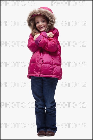 Young girl wearing winter clothing. Photographer: Mike Kemp