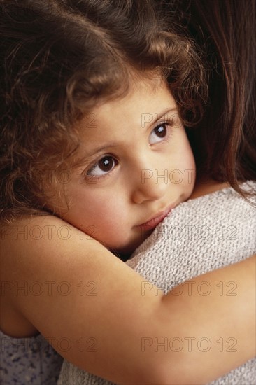 Mother comforting daughter. Photographer: Rob Lewine