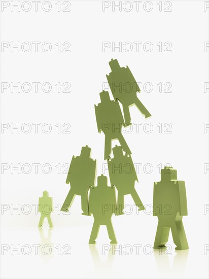 Green paper people. Photographer: David Arky