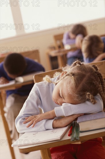 Students sleeping at desks. Photographer: Rob Lewine