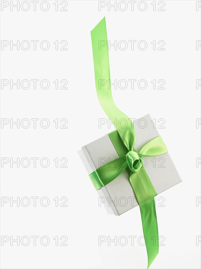 Gift and green ribbon. Photographer: David Arky