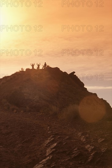 Mountain bikers on mountain peak. Photographer: Dan Bannister