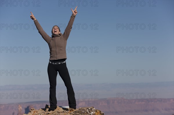 Woman at top of canyon. Photographer: Dan Bannister