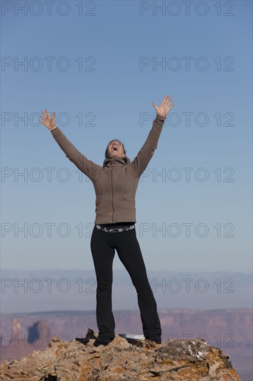 Woman at top of canyon. Photographer: Dan Bannister