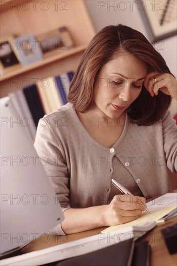 Woman working at computer. Photographer: Rob Lewine