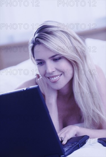 Woman typing on laptop. Photographer: Rob Lewine