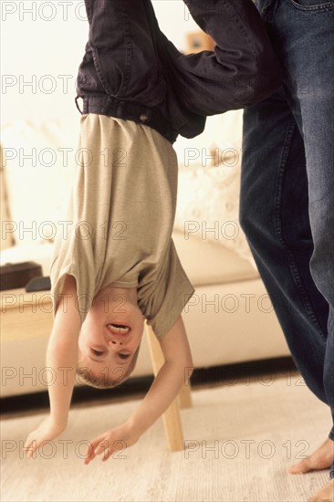 Child playing with Father. Photographer: Rob Lewine