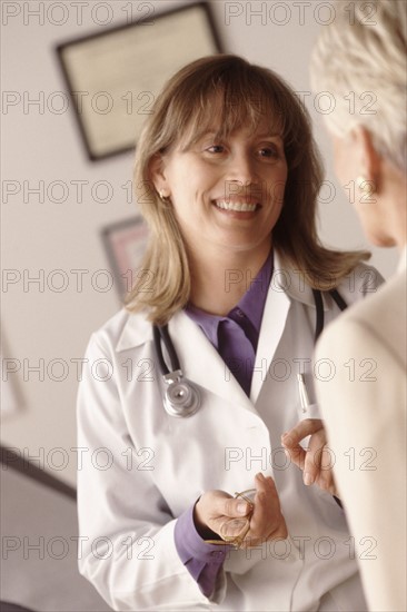 Doctor talking to patient. Photographer: Rob Lewine