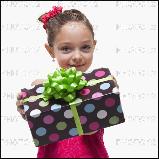 Girl with gift. Photographer: Mike Kemp