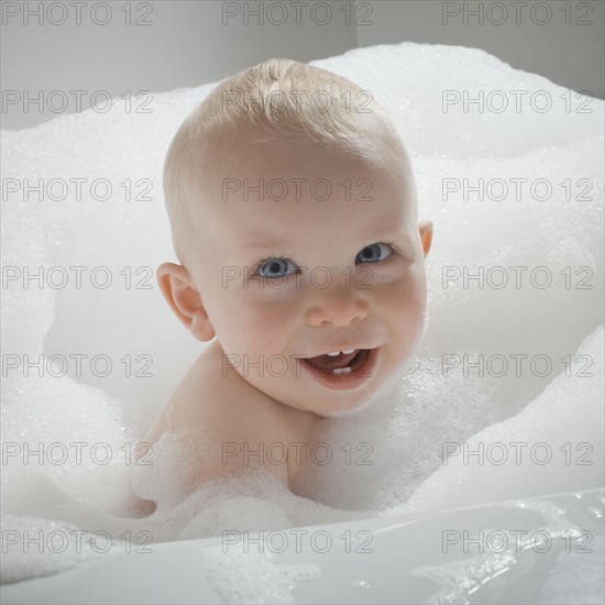 Baby in bathtub. Photographer: Mike Kemp