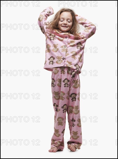 Young girl wearing pajamas. Photographer: Mike Kemp