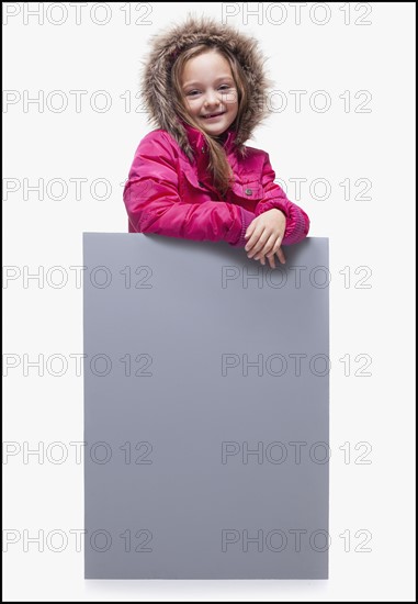Young girl wearing winter coat. Photographer: Mike Kemp