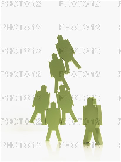 Green paper people. Photographer: David Arky