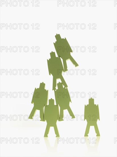 Green paper people. Photographer: David Arky