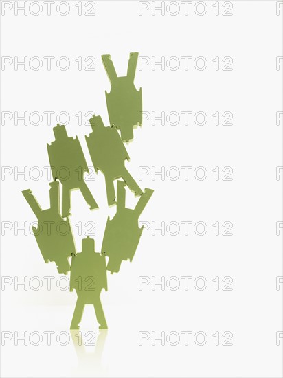 Green paper people. Photographer: David Arky