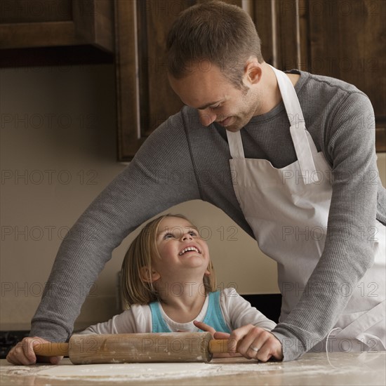 Father and daughter baking. Photographer: Mike Kemp