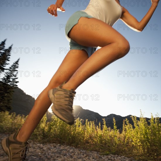 Jogger on rural trail. Photographer: Mike Kemp