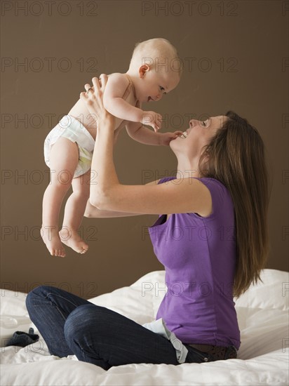 Woman holding baby. Photographer: Mike Kemp