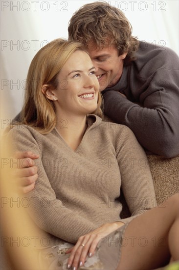 Couple relaxing at home. Photographer: Rob Lewine