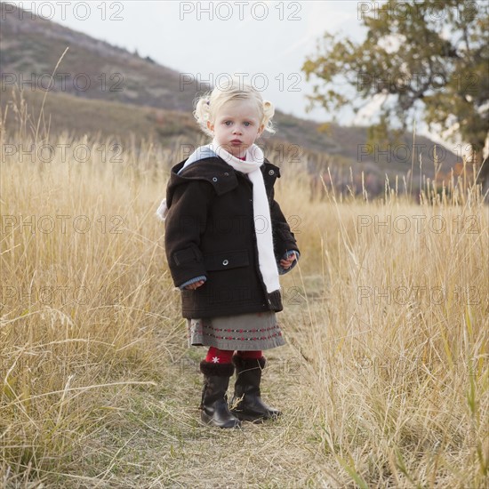 Portrait of a girl in a meadow. Photographer: Mike Kemp