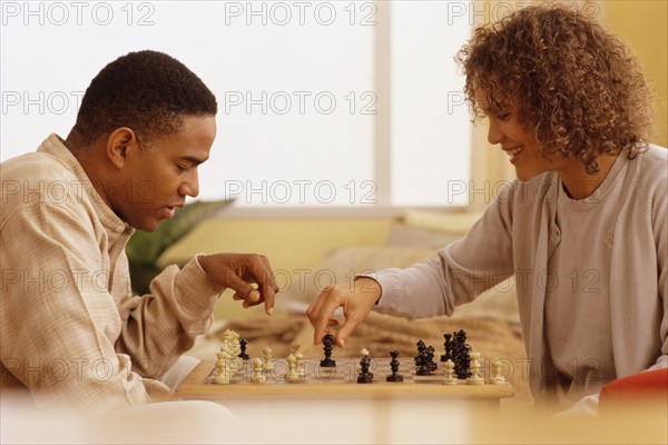 Couple playing chess. Photographer: Rob Lewine